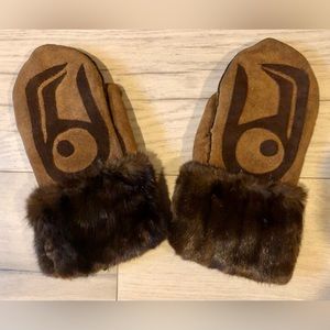 Suede and fur appliquéd mittens lined in sheepskin fur.